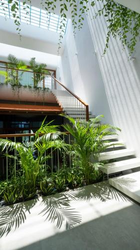a building with stairs and plants in front of it at Holi Terrace Villa in Nha Trang