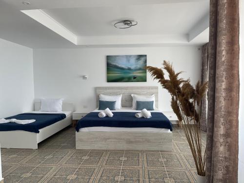 Säng eller sängar i ett rum på Aqua Villa by the Sea