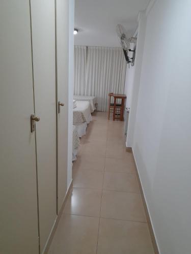 a corridor of a room with two beds at Intersur Villa Gesell in Villa Gesell
