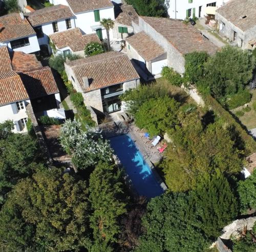 an aerial view of a house with a swimming pool at Hôtel Le Sénéchal in Ars-en-Ré