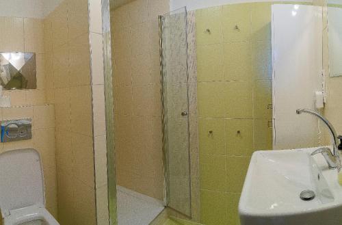 a bathroom with a shower and a toilet and a sink at Panorama apartmán 44-C in Donovaly