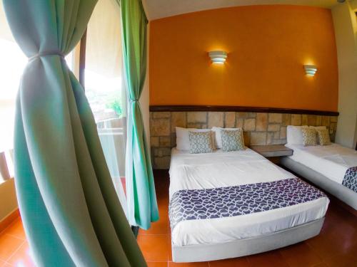 Katil atau katil-katil dalam bilik di Hotel Casa Arena