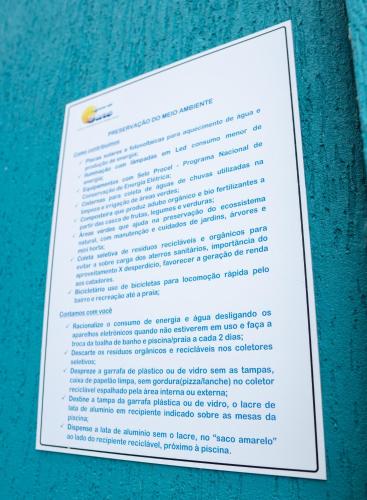 a menu for a restaurant on a blue towel at Residencial Águas de Bare in São Sebastião