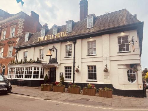 a large white building on the corner of a street at The Bell Hotel Aylesbury in Aylesbury