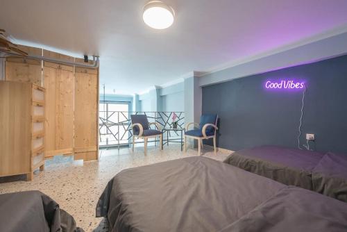 a room with two beds and a sign that reads cool wishes at Athens Loft in Athens