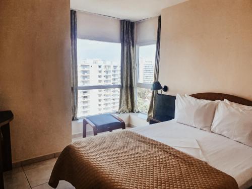 מיטה או מיטות בחדר ב-Hotel Majestic Olimp & Apartments