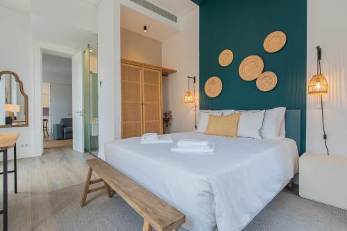 מיטה או מיטות בחדר ב-Ando Living - Abrantes Flats
