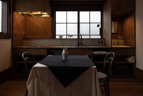 a kitchen with a table with a vase on it at Shirafuji - Vacation STAY 69369v in Suzaka