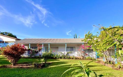 a house with a lawn in front of it at Kahina Lodge in Hanga Roa