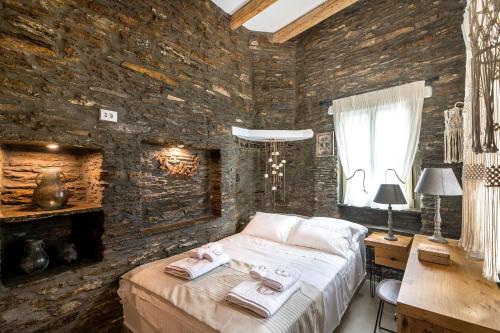 A bed or beds in a room at The Old Court Council Luxury mansion by Ifigeneia