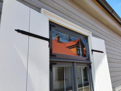 a window on the side of a house at KK Apartment in Ventspils
