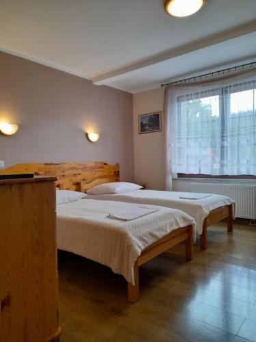 Posteľ alebo postele v izbe v ubytovaní EMAR