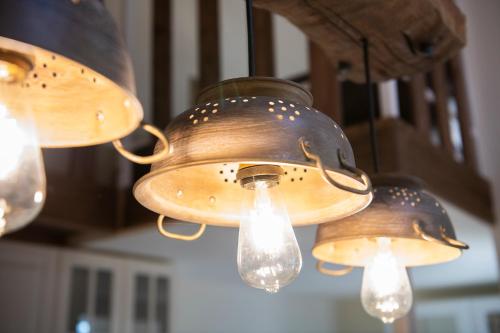 a group of lights hanging from a ceiling at 248 Boutique Studios, Sliema in Sliema