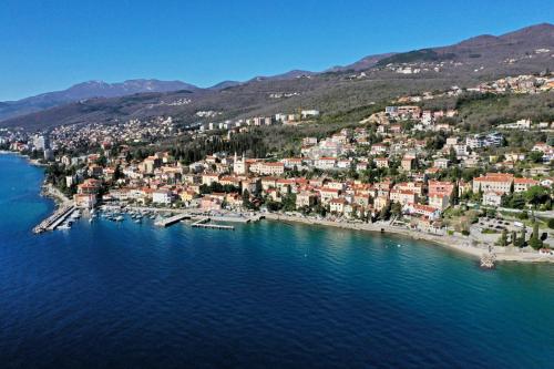 an aerial view of a town on the water at Apartments Komel II in Opatija