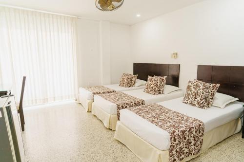 Postel nebo postele na pokoji v ubytování Hotel Las Molas