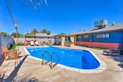 a swimming pool in the backyard of a house at Las Vegas Getaway with Patio about 3 Mi to Strip! in Las Vegas