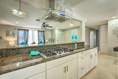 a kitchen with a stove and a counter top at Las Vegas Getaway with Patio about 3 Mi to Strip! in Las Vegas