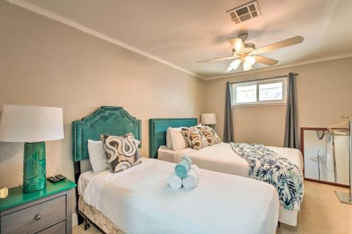 a bedroom with two beds and a ceiling fan at Las Vegas Getaway with Patio about 3 Mi to Strip! in Las Vegas