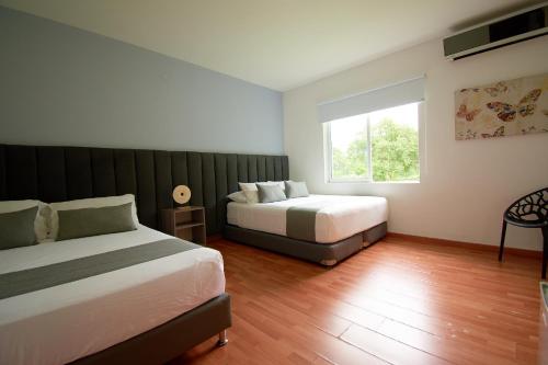 Postel nebo postele na pokoji v ubytování Arena de Santa Fe by Bernalo Hotels