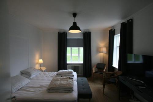 Postel nebo postele na pokoji v ubytování Riverside Hostel