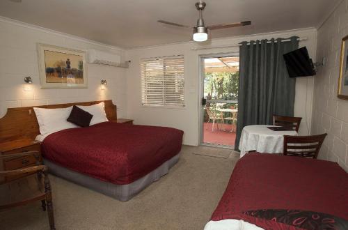 Säng eller sängar i ett rum på Maleny Hills Motel