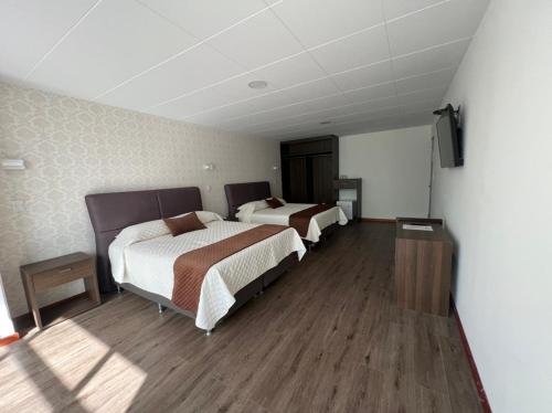 Katil atau katil-katil dalam bilik di Novum Hotel