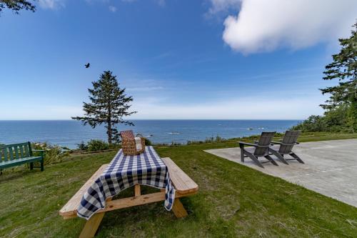 a picnic table with a checkered table cloth on it at Trinidad Pearl in Trinidad