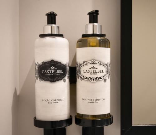 two bottles of wine sitting next to each other at Catarina Serviced Apartments in Porto