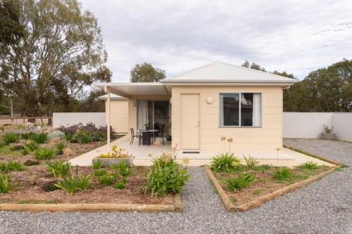 a house with a garden in front of it at CASALE COTTAGE Barossa Valley in Nuriootpa