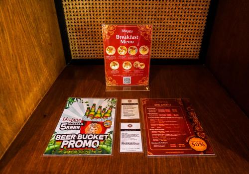 a table with two packages of beer blinderump and a box of food at Sampatti Villas in Seminyak
