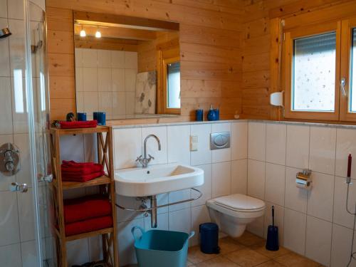 a bathroom with a sink and a toilet at Ferienhaus Friedrichsblick in Lug