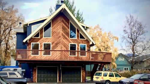 a house with a balcony on top of it at Dimond Jewel in Anchorage