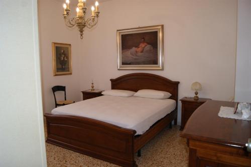 En eller flere senger på et rom på Fortunato's Apartment