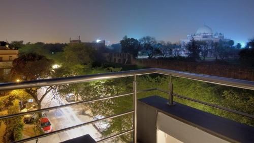 a balcony with a view of a parking lot at B Nineteen in New Delhi