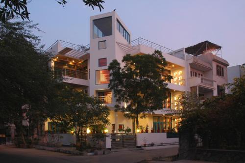 a large white building with its lights on at B Nineteen in New Delhi