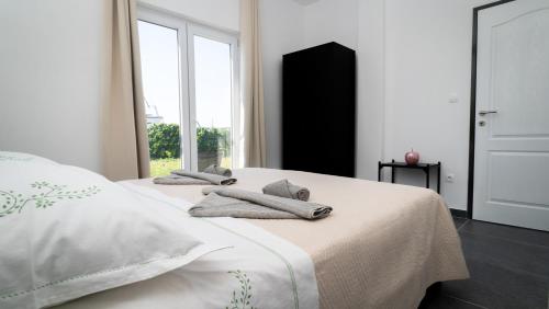 Posteľ alebo postele v izbe v ubytovaní Apartman A2 s vlastitim bazenom
