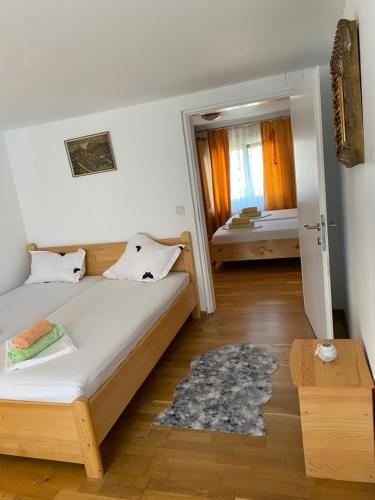 a bedroom with a bed and a room with two beds at Casa Donau Delta in Sulina