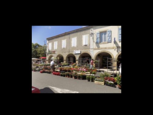 a building with a bunch of flowers in front of it at No 5 Plaisance Studio in Plaisance