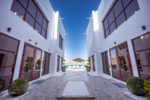 an empty courtyard of a building with large windows at Villa Asiana - Exclusive 8-Bedroom Villa with signature Amenities By Luxury Explorers Collection in Dubai