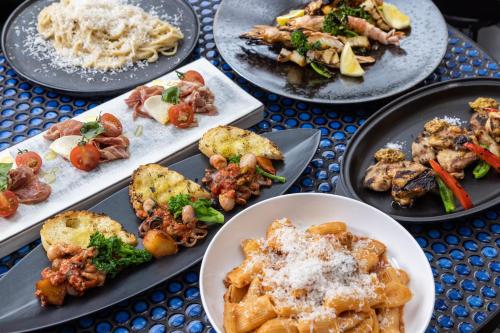 a bunch of plates of food on a table at Ace Hotel Kyoto in Kyoto