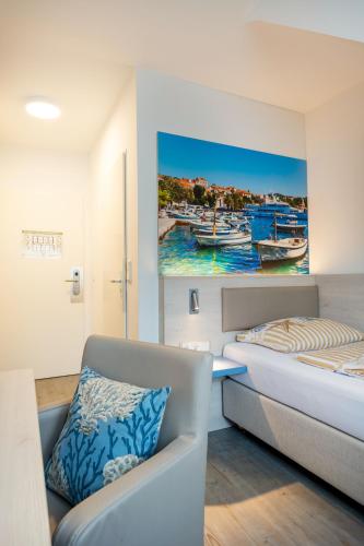 Postel nebo postele na pokoji v ubytování Hotel Arosa Düsseldorf Oberkassel