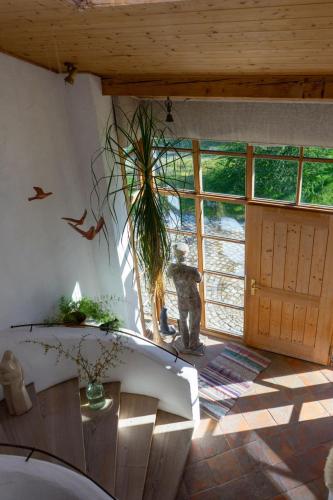 a room with a large room with a large window at Ferienwohnung mit großem Panoramafenster in Teisendorf