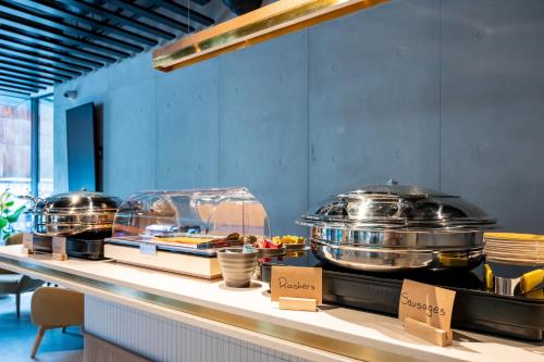 a buffet line with pots and pans on display at Staycity Aparthotels Dublin City Quay in Dublin