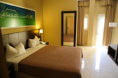 Un ou plusieurs lits dans un hébergement de l'établissement Hotel Mauricenter Nouakchott