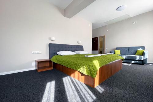 En eller flere senge i et værelse på Motel Gilau