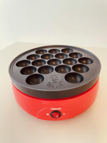 a small stove with chocolates inside of it at SAMURISE DARUMA in Fujiyoshida