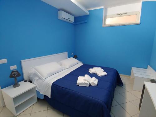 Ένα ή περισσότερα κρεβάτια σε δωμάτιο στο SORRENTO RELAIS BASEMENT