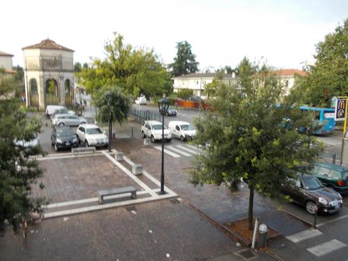 a parking lot with cars parked in a parking lot at Big Brother Bed & Rooms in Treviso