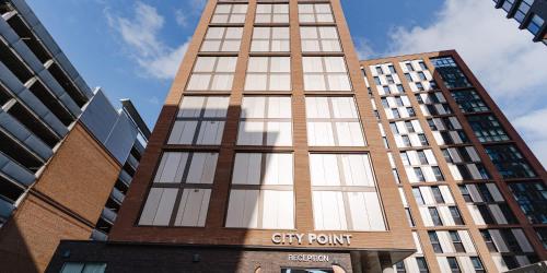 a tall building with a city point sign on it at For Students Only Canvas City Point Coventry in Coventry