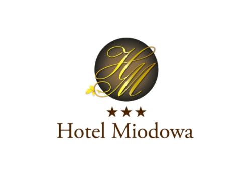 a logo for a hotel malibu at Hotel Miodowa in Krakow
